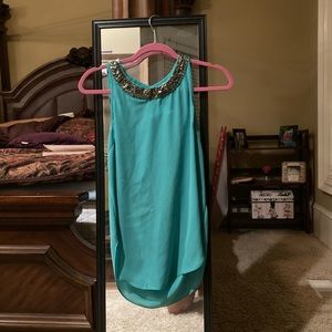 Teal sleeveless blouse